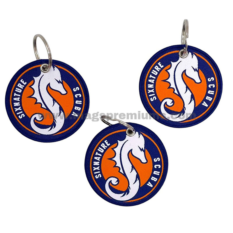 Woven Keychain Custom embroidered fabric keychain with woven border, metal split ring and personalised logo for events and souvenirs.