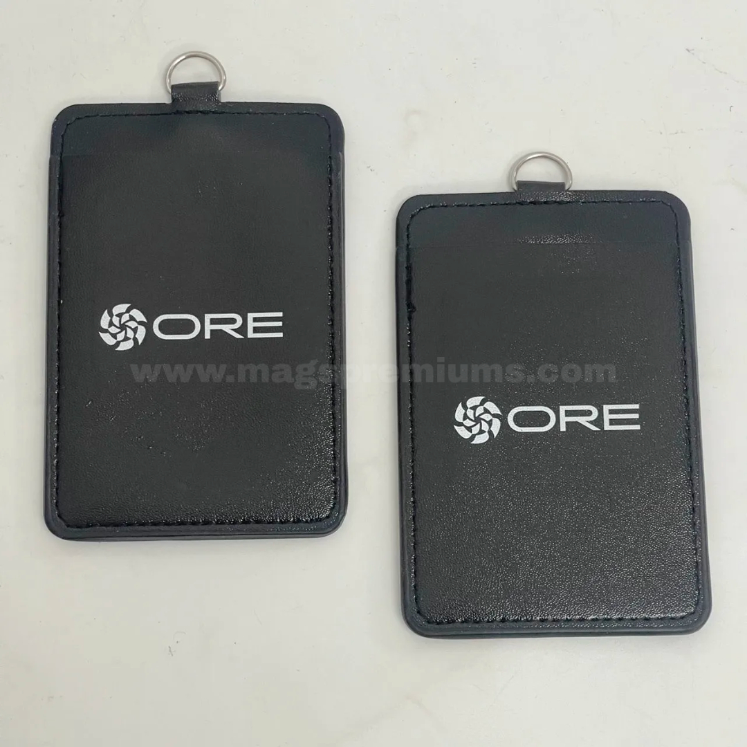 PU Card Holder Printing Custom PU card holder with printed company logo, featuring a black leather-like finish, stitched edges, and metal ring attachment for use with ID cards, staff badges, and event passes.