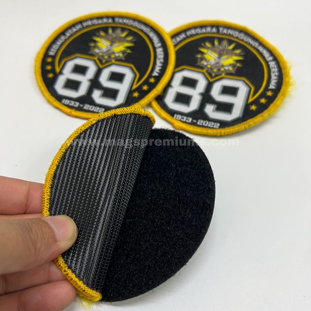 Custom embroidered cloth patches, sewn or ironed onto garments, designed for corporate giveaways, event branding, and custom fashion accessories.
