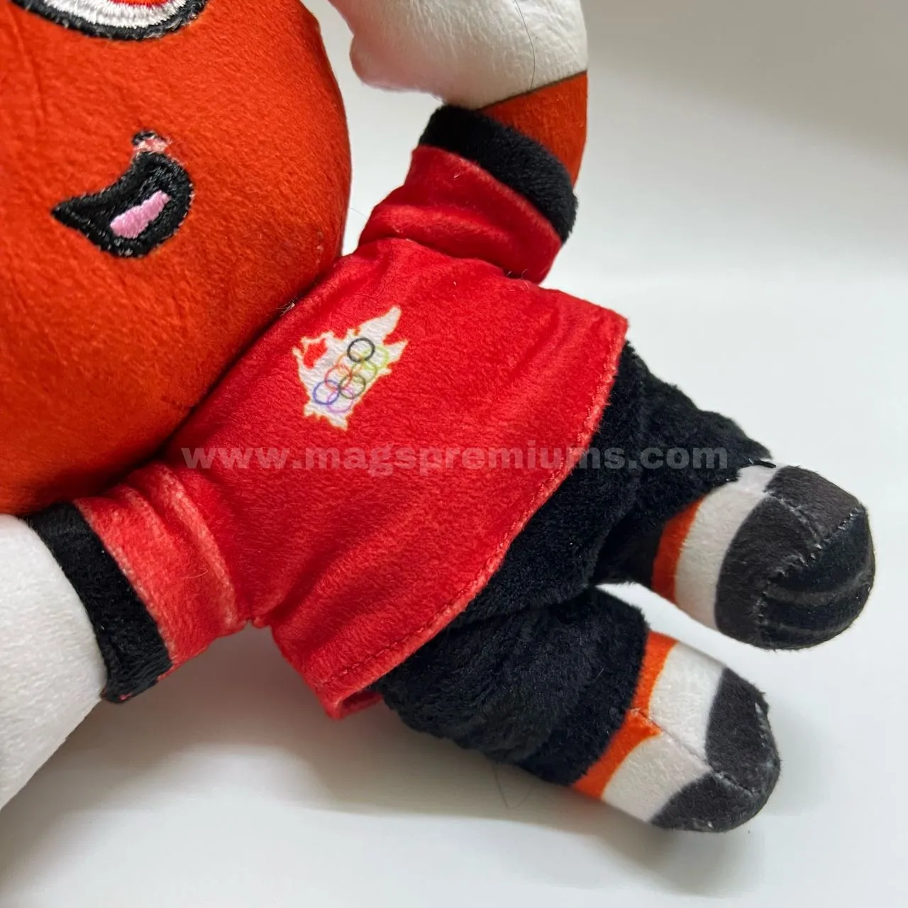 Custom Made Toy Custom mascot plush toy with embroidered logo shirt, close-up detail of personalized plush doll