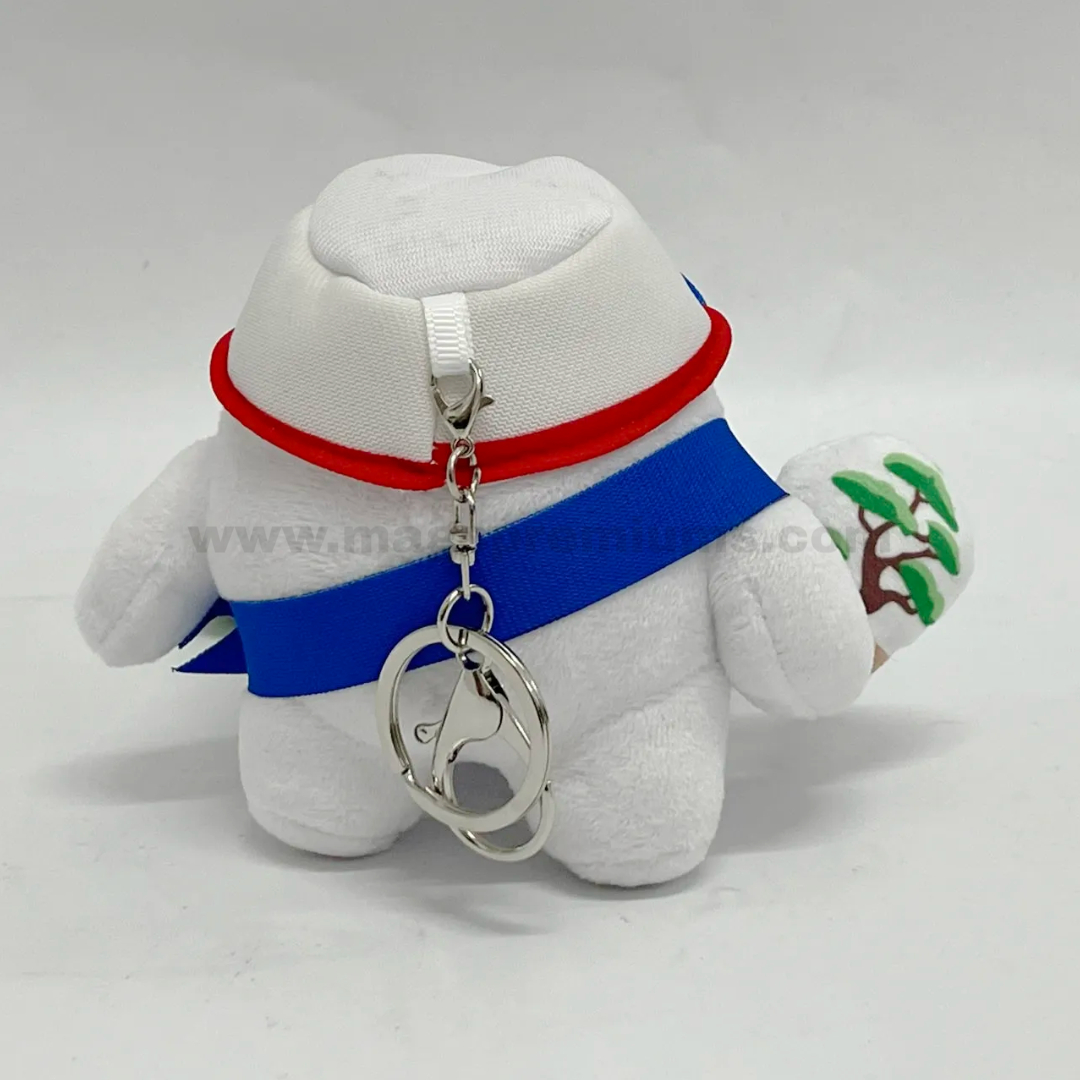 Plush Keychain Back view of a personalised plushy soft toy featuring a branded cap, blue sash, zipper attachment, and metal keyring, suitable for custom merchandise, promotional gifts, and corporate souvenirs.