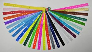 Durable pvc wristband l shape custom printed for crowd control events or entry management available in vibrant colors