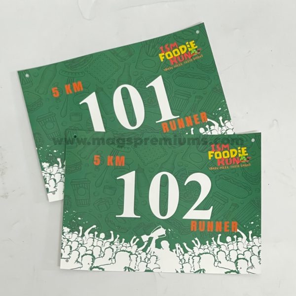 Personalized race bibs for sports events, made from durable Tyvek or fabric material. Ideal for running competitions, cycling races, and corporate sports events. Bulk printing available in Malaysia