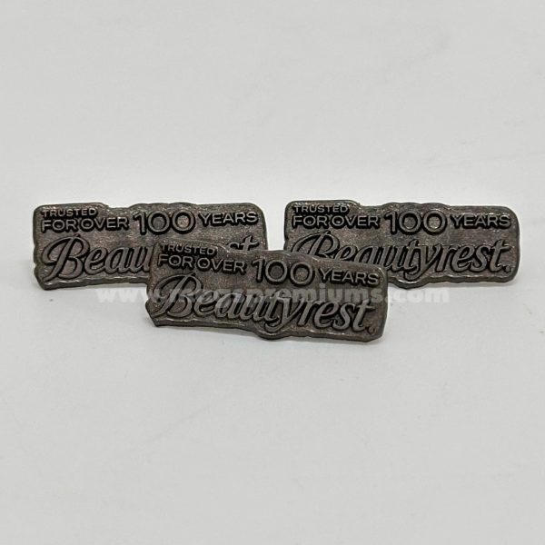High-quality custom lapel pins with embossed enamel finish, ideal for business promotions, souvenirs, and club badges. Bulk supply available in Malaysia