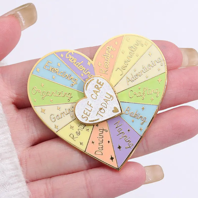 Custom Spinning Enamel Pin heart shaped enamel spinner pin with pastel segmented design held in hand