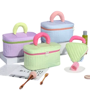 pastel travel beauty cases with handle displayed on table