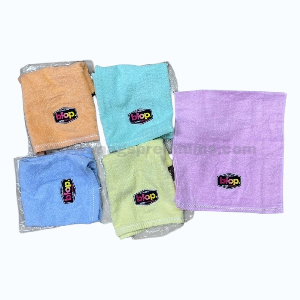 Personalized Towel Assorted custom microfiber towels with embroidered logo patches.