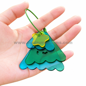 Green and blue layered acrylic Christmas tree keychain with a cord loop.