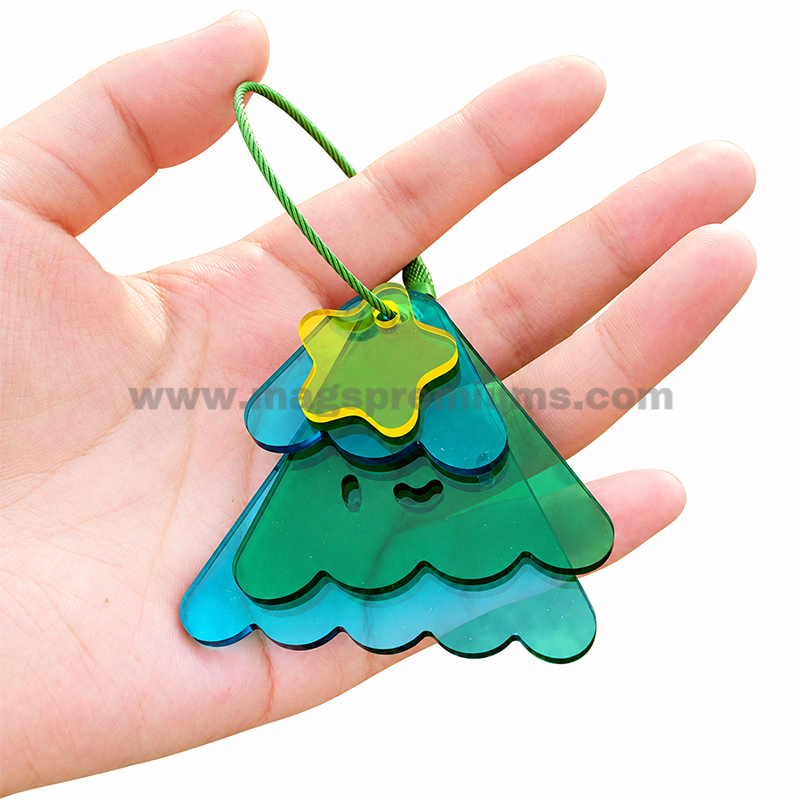 Translucent Acrylic Keychain Green and blue layered acrylic Christmas tree keychain with a cord loop.
