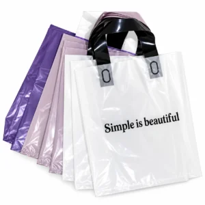 Custom PE plastic bags with loop handles in white, purple and lilac, printed with a black slogan